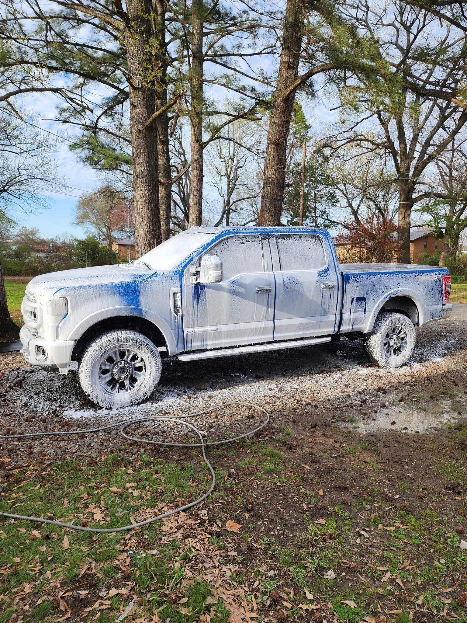 Truck covered in wash foam during a detail at Jose's Auto Detailing